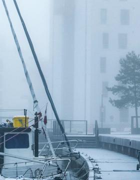 Snow and fog on the harbour in Odense